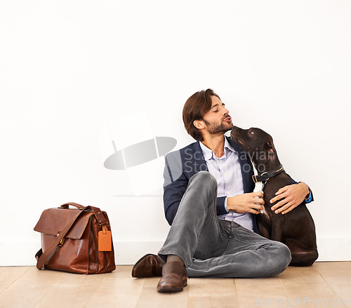Image of Cute, love and happy businessman with dog for bonding together with positive and good attitude. Career, briefcase and professional male person playing with pet, puppy or animal on floor at home.