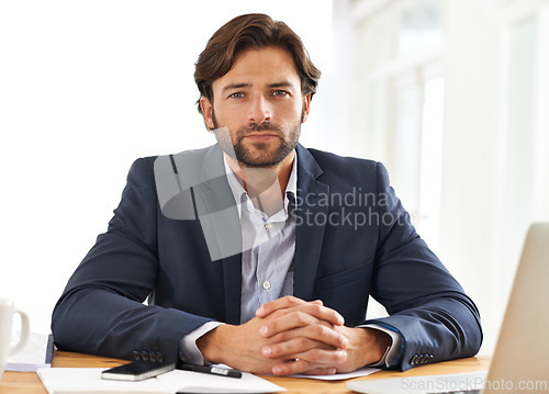 Image of Desk, laptop and portrait of businessman with pride, paperwork and serious financial analyst in office. Consultant, business advisor or man with computer, documents and research notes at startup.