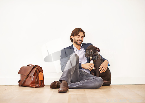 Image of Smile, love and happy businessman with pet for bonding together with positive and good attitude. Mockup, briefcase and professional male person playing with dog, puppy or animal on floor at home.