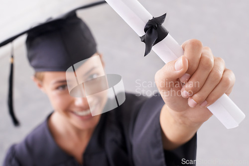 Image of Graduate, certificate and hand of happy woman in celebration for success at college. Face, graduation and closeup of student with diploma for education, achievement and smile for award in university