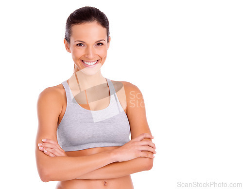 Image of Studio, woman and confident in portrait for exercise in gym clothes, fitness and arms crossed by white background. Spain model, face and positive for aerobics workout and training for strong body