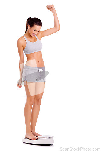 Image of Achievement, success and woman on scale in studio for weight loss, fitness or healthy diet for wellness. Body, exercise and person with motivation for workout, detox or gut health on white background