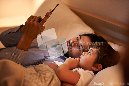 Image of Home, father and son with tablet, night and family with storytelling and connection with social media. Dad, house and boy with technology and bedtime story with lights and bonding together with app