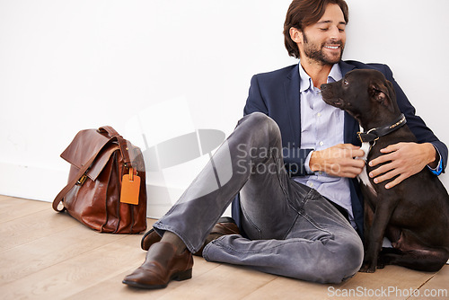 Image of Smile, love and happy businessman with dog for bonding together with positive and good attitude. Career, briefcase and professional male person playing with pet, puppy or animal on floor at home.