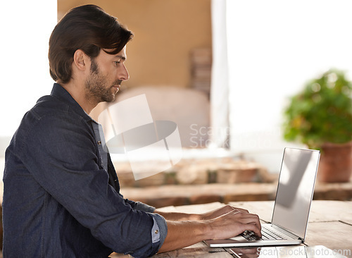 Image of Businessman, laptop and typing of email in cafe with remote work, copywriting or freelance employee. Entrepreneur, mature person or technology for reading, writing or online planning in coffee shop