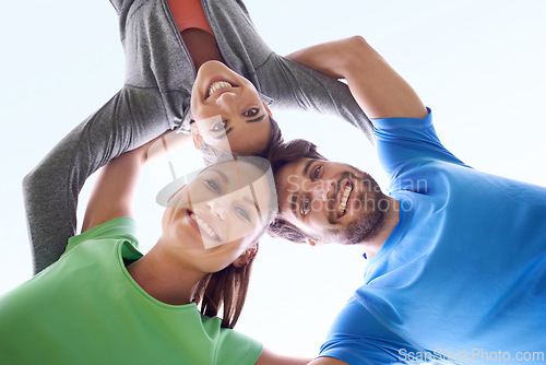 Image of Team, huddle and people in fitness with low angle portrait, workout together and support for health outdoor. Solidarity, sports and community training, exercise friends with smile and wellness