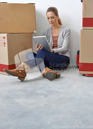 Image of Business, thinking and woman with a tablet, boxes and digital app with typing, decision and startup. Person, employee and entrepreneur with technology or choice with courier or ideas with internet