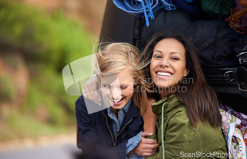 Image of Happy woman, friends and hug with a car full of luggage for road trip, holiday weekend or outdoor vacation. Female person with smile for friendship, support or care together on adventure or journey