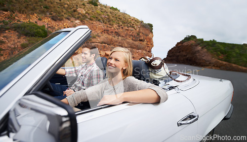 Image of Happy couple, car and driving on road trip for travel, holiday weekend or outdoor vacation on street in nature. Young man and woman with smile for transportation or getaway in convertible vehicle
