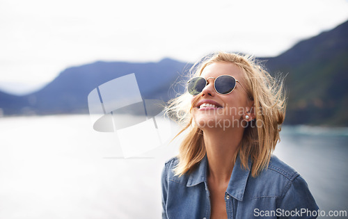 Image of Girl, smile and peace in nature for mountain as tourist in Cape Town to relax and sun. Female person, happiness and excited for adventure on excited in trip for holiday, lake and cheerful for hiking