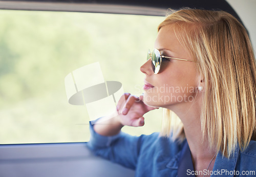 Image of Thinking, travel and woman in a car, vacation and adventure with weekend break and sunglasses. Person, road trip and girl in a vehicle and freedom with ideas and wonder with thoughts and journey