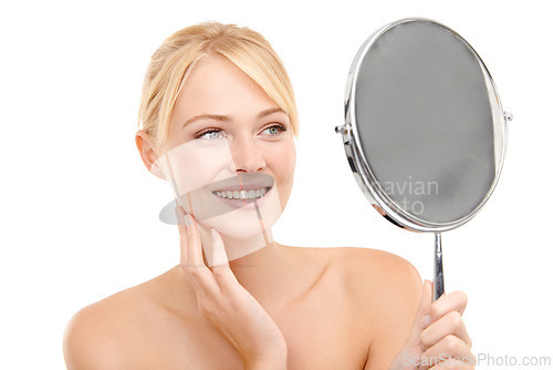 Image of Face, mirror and woman with beauty for natural skincare and wellness on white background. Reflection, vanity and admiring clean skin with healthy glow, facial treatment and hygiene with smile