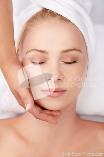 Image of Face, massage and woman at a spa with hands of masseuse for lymphatic drainage procedure from above. Zen, peace and female with facial therapy at beauty salon for skincare, wellness or stress relief