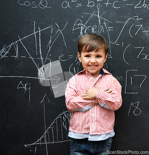 Image of Child, boy and portrait with math by blackboard with equations, happy and education in classroom at school. Kid, student and numbers for knowledge, learning and chalkboard with smile and preschool