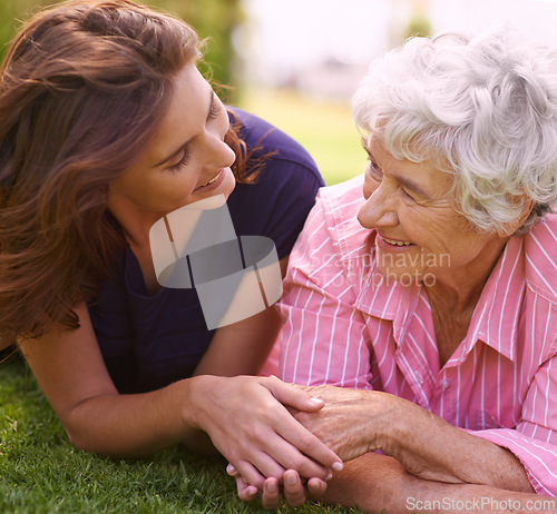 Image of Senior, mother and woman holding hands outdoor to relax in garden in summer, holiday or vacation together. Elderly, mom and family with love, care and support and smile in retirement with wellness