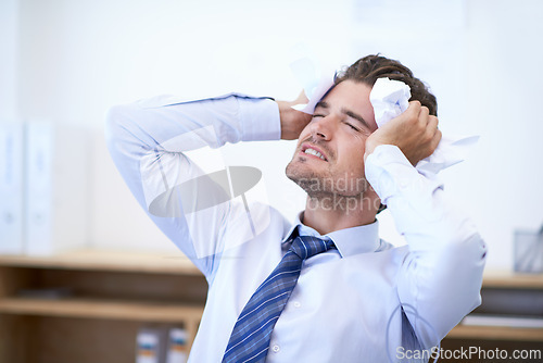 Image of Businessman, head and angry with crumpled paper, mistake and burnout for frustration, debt and headache. Stressed employee, worker and report for bills, worried and failure with audit or deadline