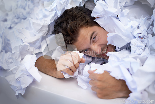 Image of Portrait, frustrated and man with pile of paperwork, crisis and tired with burnout, stress and anger. Fatigue, audit and person in documents, overworked and overwhelmed with pressure in office.