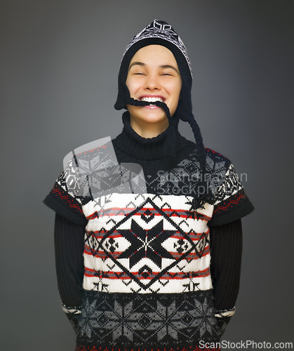 Image of Happy, fashion and portrait of woman in studio with smile for winter style, trendy clothes and outfit. Attractive, isolated and person in hat with confidence, pride and joy on gray background