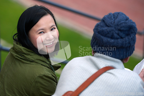 Image of Back view, Asian woman and university student outdoor, smile and sitting with friend to relax, chill and think. College, campus and share information to study with tips and notes for education