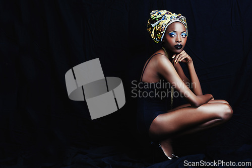 Image of Black woman, turban and thinking with fashion, head scarf and mockup in studio. Cosmetics, trendy and style with African female person from Kenya with traditional silk wrap with dark background