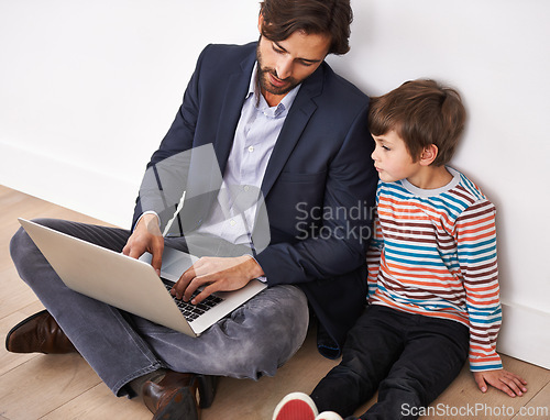 Image of Father, son and bonding on floor with laptop for remote work with video streaming, online games and movies in home. Family, parent and child with technology on ground for relax, communication and fun