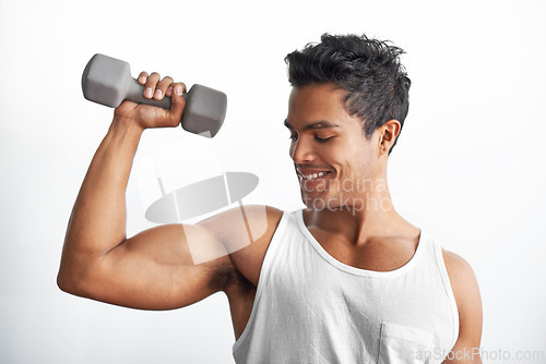 Image of Gym, fitness and happy man with dumbbell in studio for weightlifting, sports or resilience on white background. Training, face or male bodybuilder with space for power, performance or bicep challenge