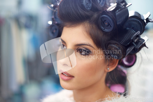 Image of Woman face, hair and makeup with curlers in salon, cosmetic care and fashion model for treatment. Beauty, actor or celebrity backstage with hairdresser and styling, haircare with skin and glamour