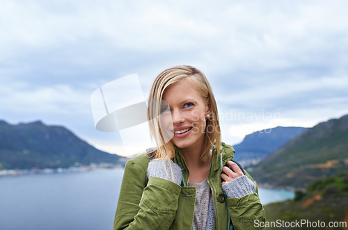 Image of Woman, hiking and mountains for outdoor travel with wellness, fitness and location in Finland for eco friendly tourism. Young person with backpack for trekking, journey and thinking of her adventure