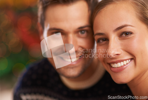 Image of Portrait, Christmas and couple with love, festive season and party with romance and home with Xmas. Face, apartment and man with woman or celebration with holiday and smile with marriage and cheerful