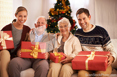 Image of Grandparents, family with Christmas or portrait for festive season together for celebration, presents or holiday. Elderly man, woman and couch at home in Canada for bonding joy, vacation or relaxing