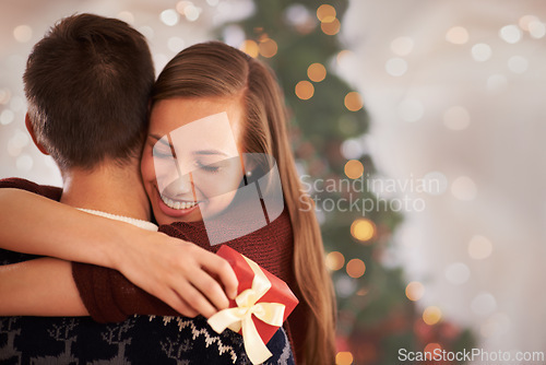 Image of Home, hug and couple with love, Christmas and festive season with marriage and holiday. Apartment, embrace or man with woman or vacation with Xmas or celebration with relationship or bonding together