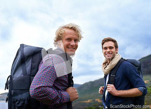 Image of Happy man, portrait and friends with backpack for hiking mountain, travel or sightseeing on outdoor journey in nature. Male person or young hikers with bag on back for trekking, fitness or adventure