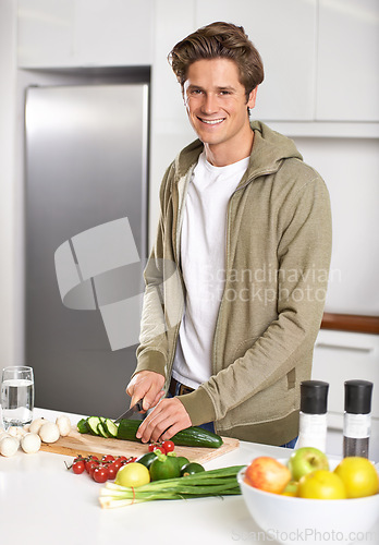 Image of Diet, cooking and man cutting vegetables on kitchen counter with salad, wellness and nutrition in home. Wood board, knife and healthy food process with brunch, chef and vegan meal prep in apartment