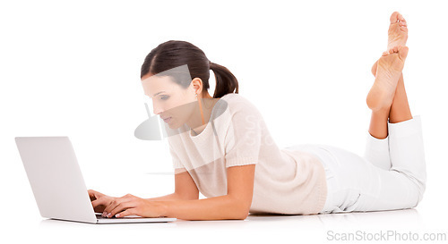 Image of Woman, laptop and typing in studio for online communication as journalist for research project, networking or internet. Female person, white background and mockup or teach writing, email or browsing