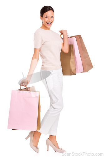 Image of Excited, shopping and portrait of woman on a white background with bag for sale, discount and deal. Fashion, happy customer and isolated person for retail products, consumerism and purchase in studio