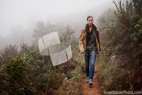 Image of Portrait, travel and woman in nature for hiking, wellness or morning walk outdoor in winter. Path, trekking and female person in a forest for fresh air, camping or adventure, journey or campsite fun