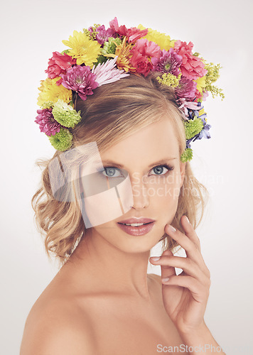 Image of Woman, portrait or flower on crown in studio with makeup or confidence for cosmetics, beauty or skincare. Spring aesthetic, model and face or floral headband with glow or wellness on white background