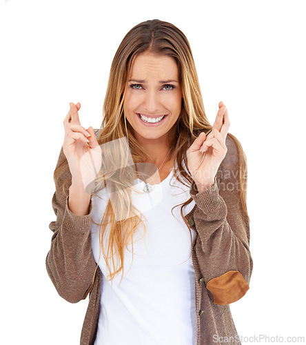 Image of Woman, portrait and crossed fingers for hope in studio, praying and wish on white background. Female person, luck and faith symbol or icon for superstition, emoji and nervous for competition winner