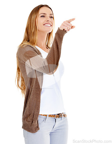 Image of Woman, pointing and happy for recommendation in studio, presentation and mockup space for information. Female person, direction and guide to promotion or announcement, smiling and discount or deal