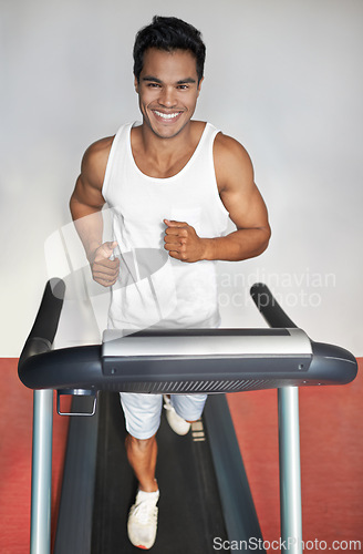 Image of Smile, fitness and portrait of man on treadmill in gym for health, wellness and body training. Happy, running and male athlete on cardio machine for speed exercise or workout in sports center.