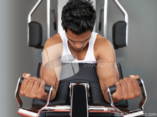 Image of Challenge, weights and man with gym machine, fitness and workout with endurance and progress. Bodybuilder, person and guy in a wellness center, strong and muscle with strength training and healthy