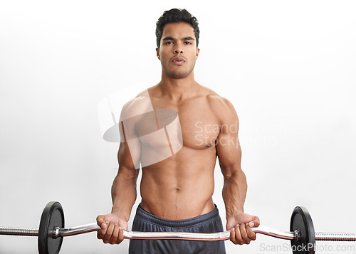 Image of Man lifting barbell, portrait and fitness in gym, strength training and endurance with bodybuilding. Exercise, mockup space and person with equipment, power and workout in a wellness center or muscle