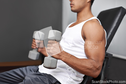 Image of Closeup, dumbbells and man with fitness, exercise and strength training with progress and challenge. Bodybuilder, gym and person with gym equipment and muscle with workout, wellness center and power