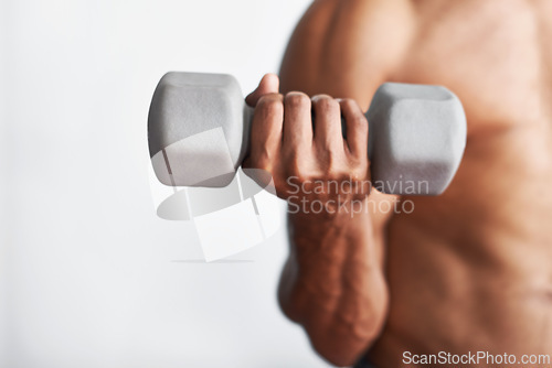 Image of Closeup, hand and man with dumbbell, exercise and weights training for wellness and endurance. Person, bodybuilder and guy with equipment and progress with fitness and strong with health and energy