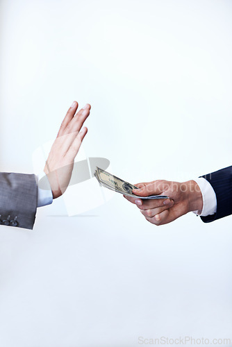 Image of Business people, hands and rejection with money for bribe, payment or fraud on a white studio background. Closeup of employee saying no to cash, dollar bills or paper for secret or bribery on mockup