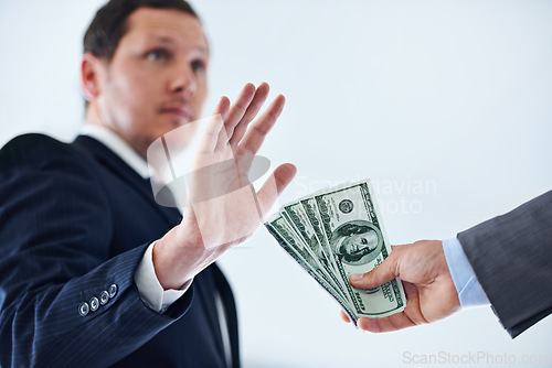 Image of Businessman, hands and rejection with money for bribe, payment or fraud on a white studio background. Man or employee saying no to cash, dollar bills or paper for scam, secret or bribery on mockup