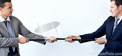 Image of Businessman, rope and tug of war for challenge, mission or strength of rivals on a blue studio background. Man, business employees or colleagues hands pulling strong cable for competition on mockup