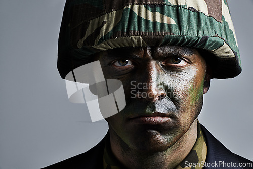 Image of Man, portrait and soldier with camouflage for military war or battle on a gray studio background. Closeup of male person, army or commander with face paint or helmet in undercover disguise on mockup