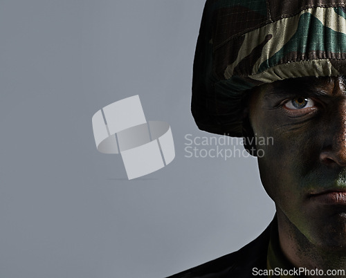 Image of Man, portrait and soldier with camouflage for army, military war or battle on a gray studio background. Closeup of male person or commander with face paint or helmet in undercover disguise on mockup