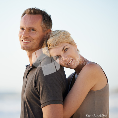 Image of Couple, hug and portrait on beach or holiday relax in California for marriage vacation, together or summer. Man, woman and face for date in paradise for stress relief or outdoor, calm or relationship